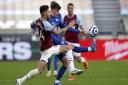 Chelsea’s Mason Mount and West Ham United's Ryan Fredericks (left) battle for the ball during the Premier League match at London Stadium. Picture date: Saturday April 24, 2021.