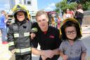 Fire Cadet Kyle Orton (centre) with youngsters at last year's Dagenham Fire Station open day (Picture: Melissa Page)