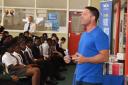 Steve Backshall talks in an assembly for All Saints pupils
