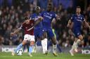 West Ham United's Manuel Lanzini has a shot at goal as Chelsea's Antonio Rudiger attempts to block during the Premier League match at Stamford Bridge, London.