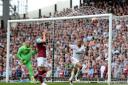 Swansea City's Andre Ayew (right) celebrates scoring their second goal of the game as West Ham United's Aaron Cresswell and goalkeeper Darren Randolph show their dejection during the Barclays Premier League match at Upton Park, London.