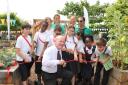 John Biggs cuts the ribbon at the Manorfield Primary School edible playground. Picture: TRUDI HOLDEN