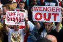 Arsenal fans protest after the 2-2 draw at the Etihad Stadium