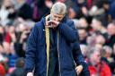 Arsenal manager Arsene Wenger looks downcast after his side's 3-2 defeat at Old Trafford