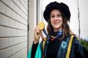 BMX star and honorary doctorate of sport recipient Bethany Shriever with her Tokyo 2020 gold medal.