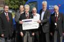 Lodge members and Peter Ellis with the cheque