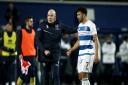 Queens Park Rangers manager Mark Warburton (left) on the pitch with Macauley Bonne (right) after the final whistle during the Sky Bet Championship match at the Kiyan Prince Foundation Stadium, London.