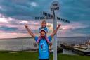 Dave Thomas with daughter Willow at the completion of the walk in John o'Groats