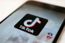 TikTok refuses to recognise the fair value of your songs, says Universal Music (Kiichiro Sato/AP/PA)