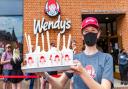 File image of a Wendy's staff member with a tray of Frostys.