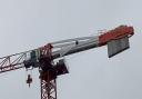 A man who has been on top of a crane in Canning Town since Wednesday morning has vowed to continue his protest.