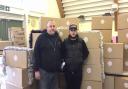 Peter and Mark McCabe from AGS Doors and Shutters with the donation of hampers.