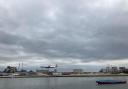A plane lands at London City Airport across the water from Royal Albert Dock in Newham CREDIT: Robert Firth