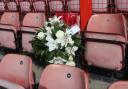 A wreath is left in the East Stand in memory of Orient fan Derek Reynolds