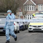 Forensic officers at the scene in Tavistock Gardens, Goodmayes, after two men died at a property in the street in January 2021