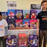 Neo Jain Naha, nine, hands over more than 400 advent calendars to AAA's James Corcoran