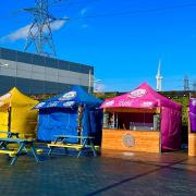 StreetCube vendors will serve their food from brightly coloured stalls in Gallions Reach Shopping Park.