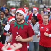 Participants join the Festive Run dressed as Santas at the Queen Elizabeth Olympic Park, Stratford.