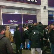 Crowds seen gathering around the East Ham cashpoint