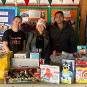 Charity Thought Machine volunteers with their donation to the 2023 Toy Appeal