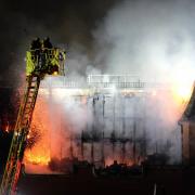A dramatic photo captured the moment firefighters tackled the blaze