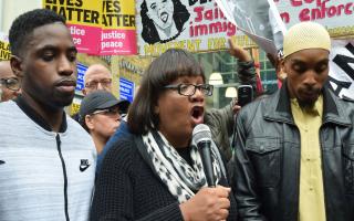 Diane Abbott MP joined Esa, father of Rashan, and (left) speaker L. Tavares, 31,outside Stoke Newington police station. Picture: Polly Hancock