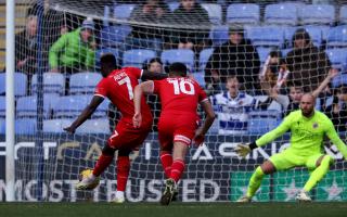 Leyton Orient's Dan Agyei (left) scores from the penalty spot at Reading. Picture: STEVEN PASTON/PA